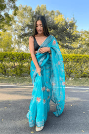 Printed organza saree in sea green with coding sequin work.