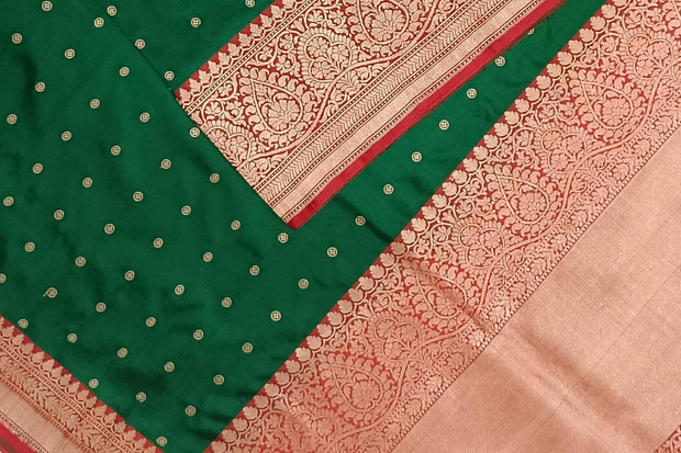 Handloom Banarasi katan pure silk saree in  bottle green with small motifs
