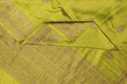 Handloom Banarasi katan pure silk saree in mehndi green in dupion finish with floral motifs .