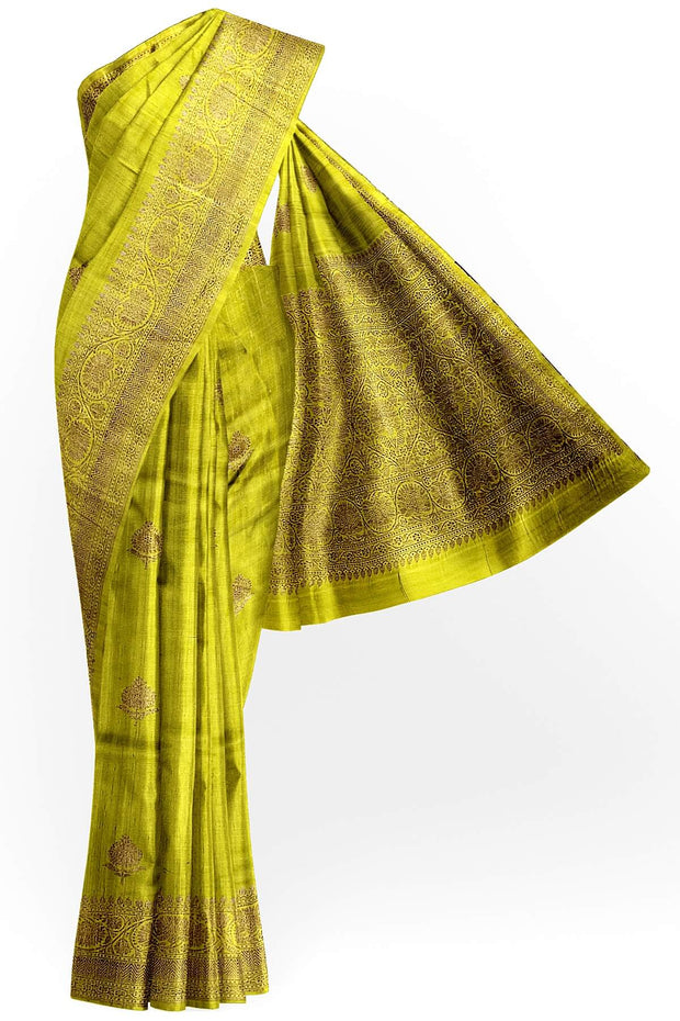 Handloom Banarasi katan pure silk saree in mehndi green in dupion finish with floral motifs .