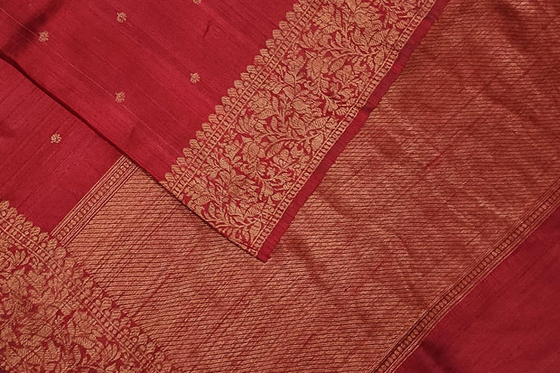 Handloom Banarasi katan pure silk saree in maroon in dupion finish with small motifs .