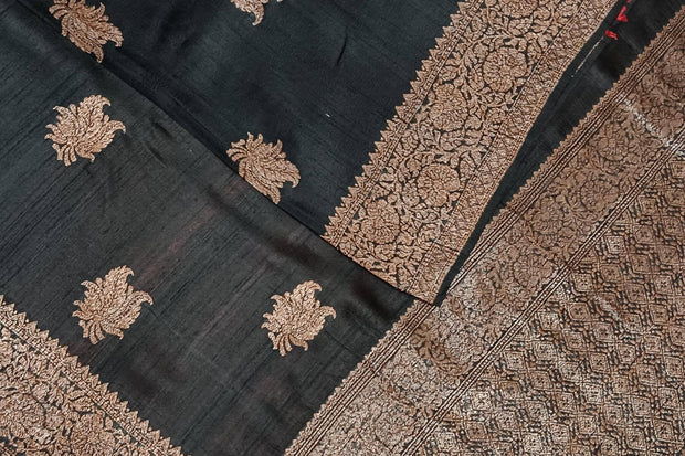 Handloom Banarasi katan pure silk saree in black in dupion finish with floral motifs .