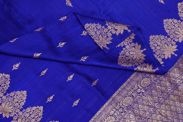 Handloom Banarasi katan pure silk saree in royal blue in dupion finish with floral motifs .