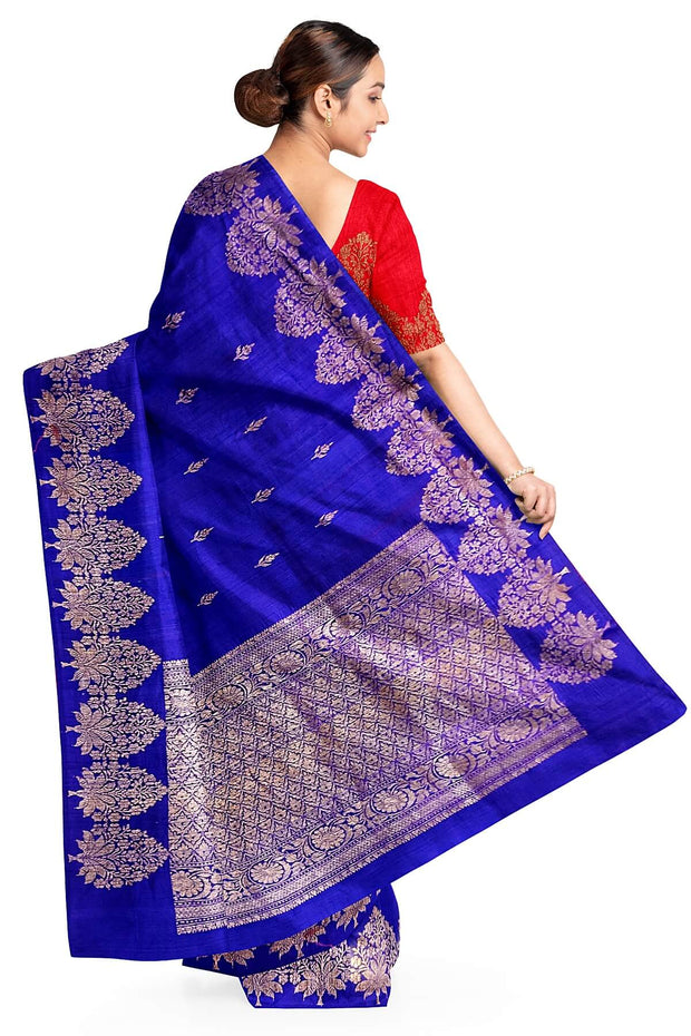 Handloom Banarasi katan pure silk saree in royal blue in dupion finish with floral motifs .