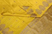 Handloom Banarasi katan pure silk saree in yellow in dupion finish with floral motifs.