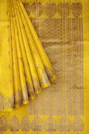 Handloom Banarasi katan pure silk saree in yellow in dupion finish with floral motifs.