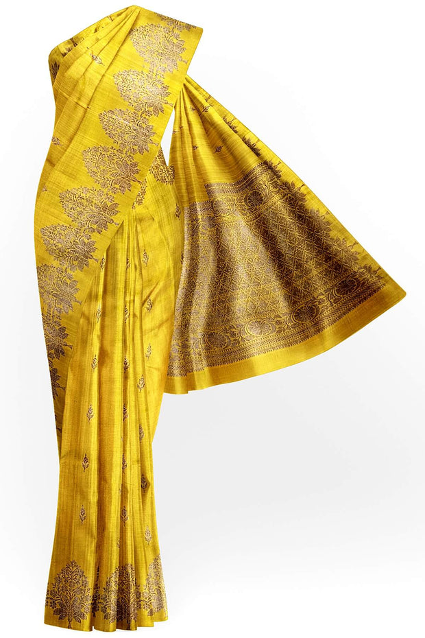 Handloom Banarasi katan pure silk saree in yellow in dupion finish with floral motifs.