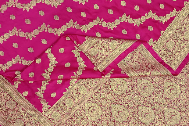 Banarasi mashru silk saree in  pink in leheriya pattern with motifs and a  contrast pallu.