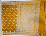 Banarasi mashru silk saree in  mustard in leheriya pattern with motifs .