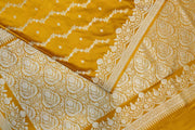 Banarasi mashru silk saree in  mustard in leheriya pattern with motifs .