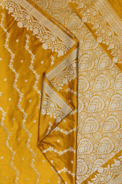 Banarasi mashru silk saree in  mustard in leheriya pattern with motifs .