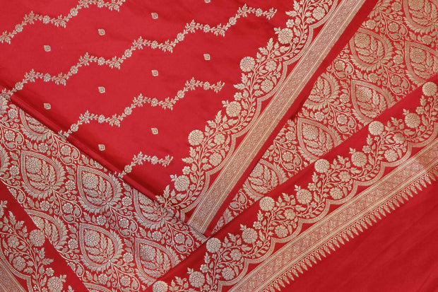 Banarasi mashru silk saree in  magenta in leheriya pattern with motifs .