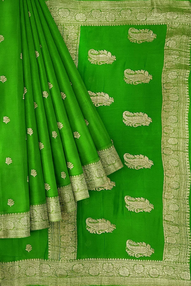 Banarasi silk chiffon  saree in green  with silver  buttis &  border