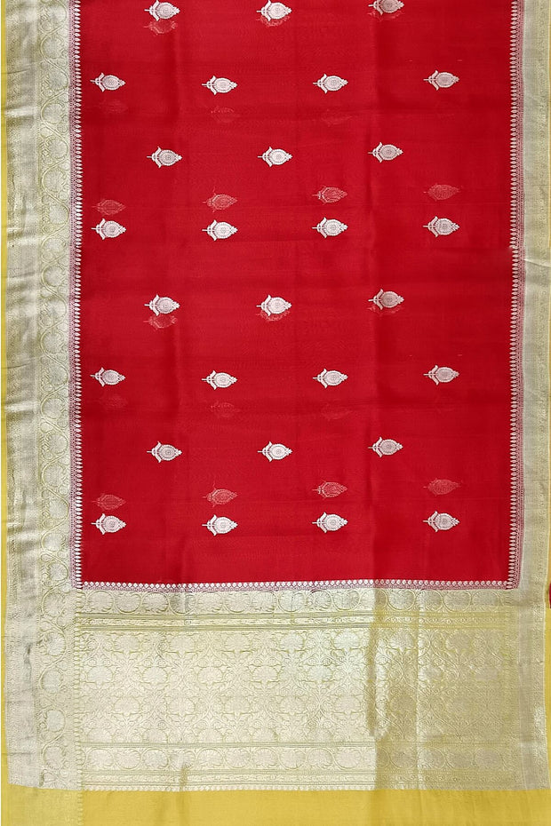 Banarasi kora ( organza) silk saree in red with floral motifs on the body