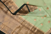 Banarasi kora ( organza) silk saree in pista green with motifs