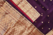 Banarasi kora ( organza) silk saree in purple with  gold motifs.