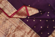 Banarasi kora ( organza) silk saree in purple with  gold motifs.