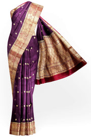 Banarasi kora ( organza) silk saree in purple with  gold motifs.