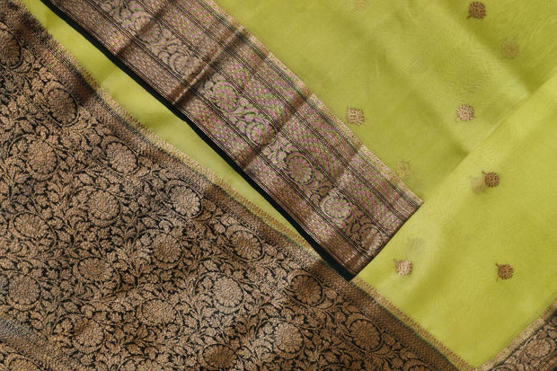 Banarasi kora ( organza) silk saree in gram green with  gold motifs.