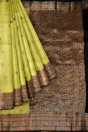 Banarasi kora ( organza) silk saree in gram green with  gold motifs.