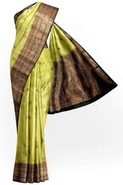 Banarasi kora ( organza) silk saree in gram green with  gold motifs.