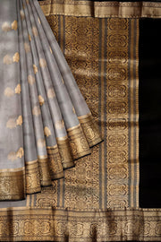 Banarasi kora ( organza) silk saree in grey with  gold motifs.