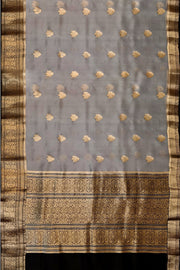 Banarasi kora ( organza) silk saree in grey with  gold motifs.