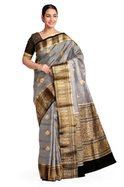 Banarasi kora ( organza) silk saree in grey with  gold motifs.