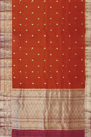 Banarasi kora ( organza) silk saree in red with  gold motifs.