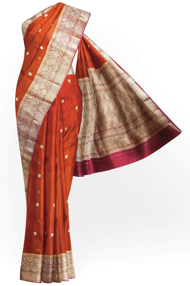 Banarasi kora ( organza) silk saree in red with  gold motifs.