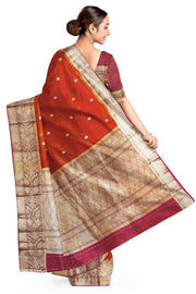 Banarasi kora ( organza) silk saree in red with  gold motifs.