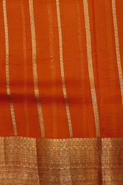 Banarasi kora ( organza) silk saree in black with  gold motifs.