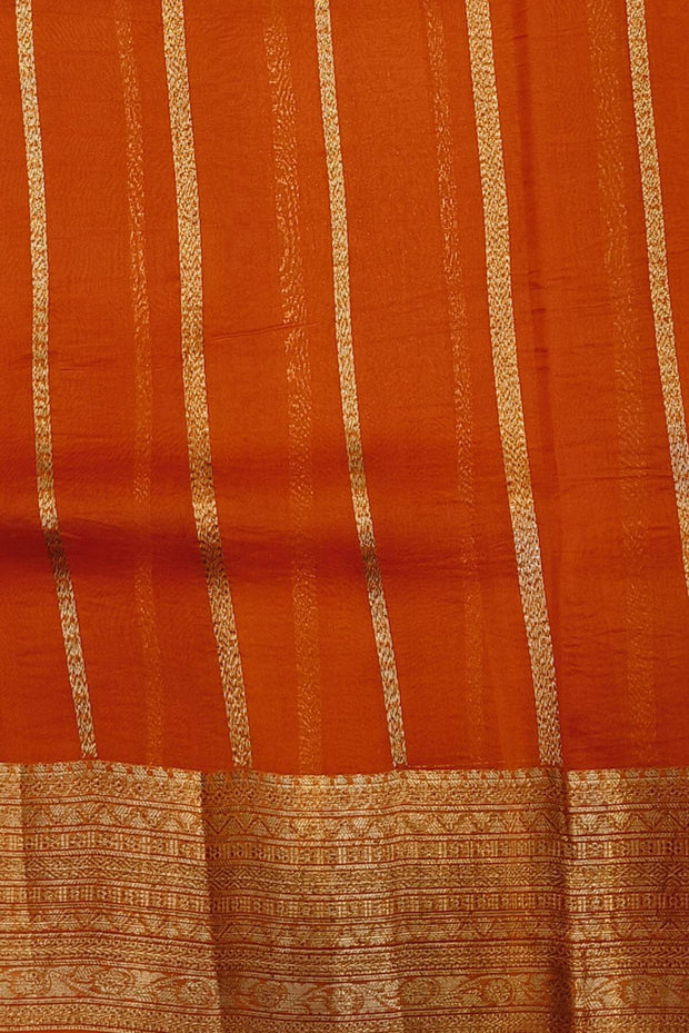 Banarasi kora ( organza) silk saree in black with  gold motifs.