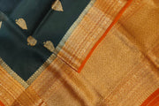 Banarasi kora ( organza) silk saree in black with  gold motifs.