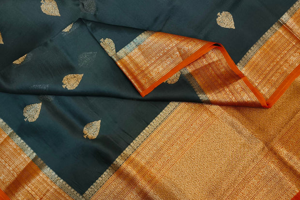 Banarasi kora ( organza) silk saree in black with  gold motifs.