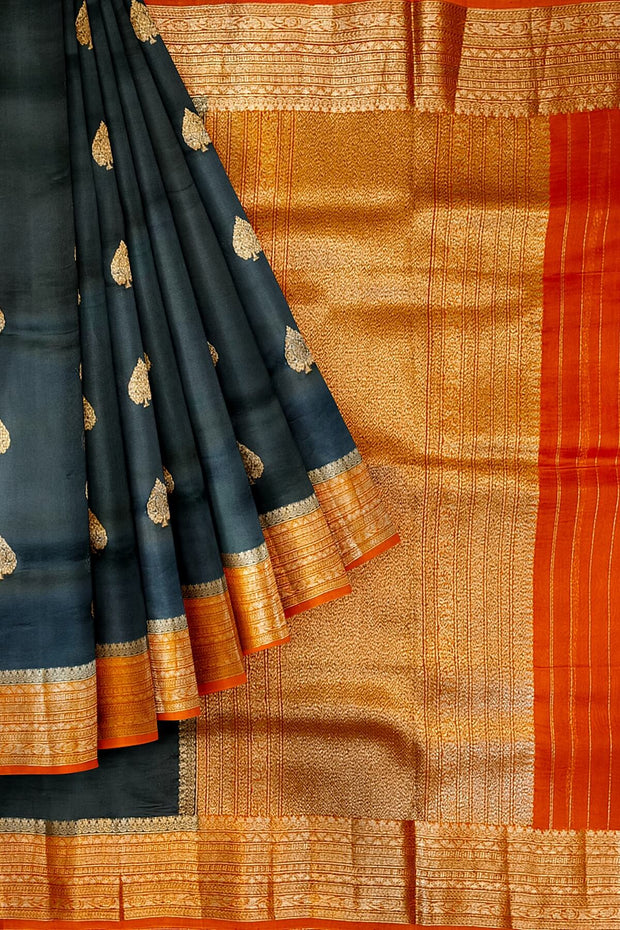 Banarasi kora ( organza) silk saree in black with  gold motifs.