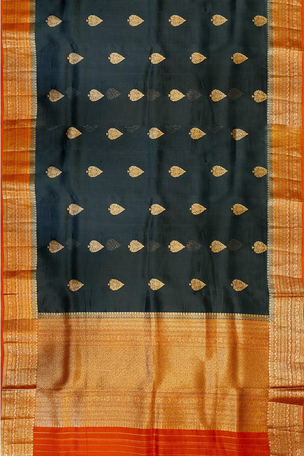 Banarasi kora ( organza) silk saree in black with  gold motifs.