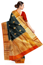 Banarasi kora ( organza) silk saree in black with  gold motifs.