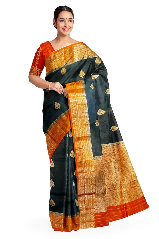 Banarasi kora ( organza) silk saree in black with  gold motifs.