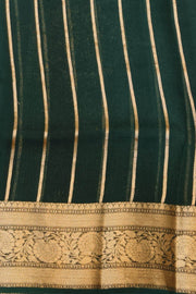 Banarasi kora ( organza) silk saree in sky blue with  gold motifs.