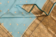 Banarasi kora ( organza) silk saree in sky blue with  gold motifs.