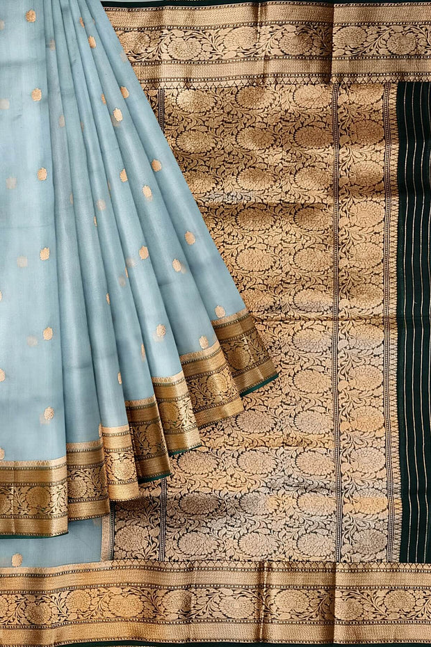 Banarasi kora ( organza) silk saree in sky blue with  gold motifs.