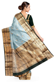 Banarasi kora ( organza) silk saree in sky blue with  gold motifs.