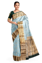 Banarasi kora ( organza) silk saree in sky blue with  gold motifs.