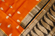 Banarasi kora ( organza) silk saree in orange with  gold motifs.