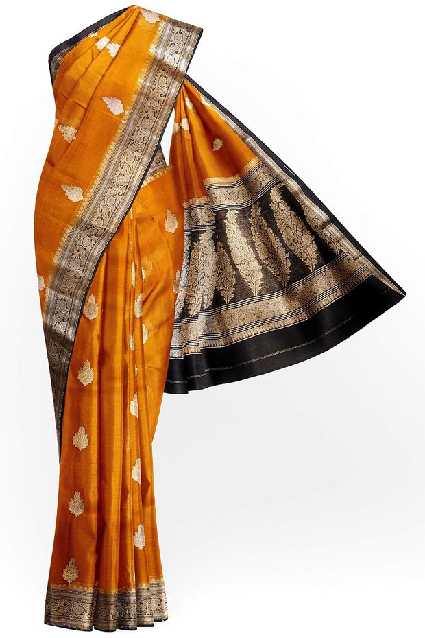 Banarasi kora ( organza) silk saree in orange with  gold motifs.