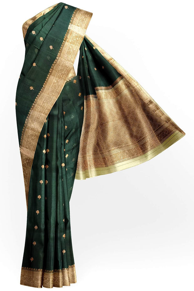 Banarasi kora ( organza) silk saree in bottle green with  gold motifs.