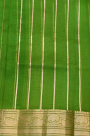 Banarasi kora ( organza) silk saree in mustard with  gold motifs.