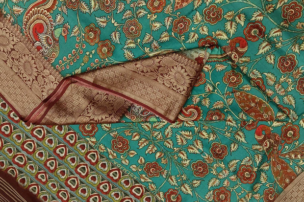 Dola silk saree with floral vines & peacocks in green