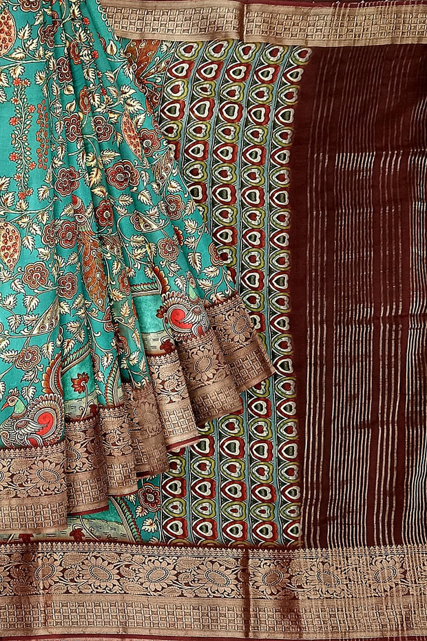 Dola silk saree with floral vines & peacocks in green